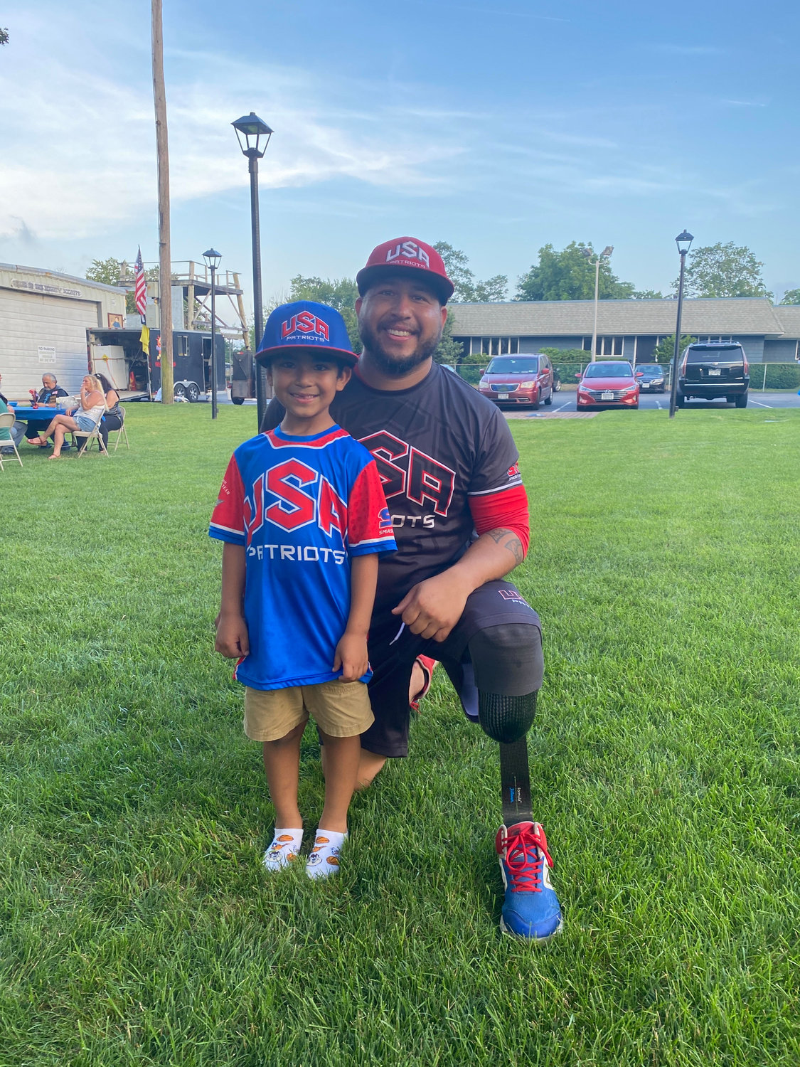 Player Saul Monroy (right) and his son Jayden. Monroy made the base hit that scored the USA Patriots the win.  Monroy is from El Paso, Texas.